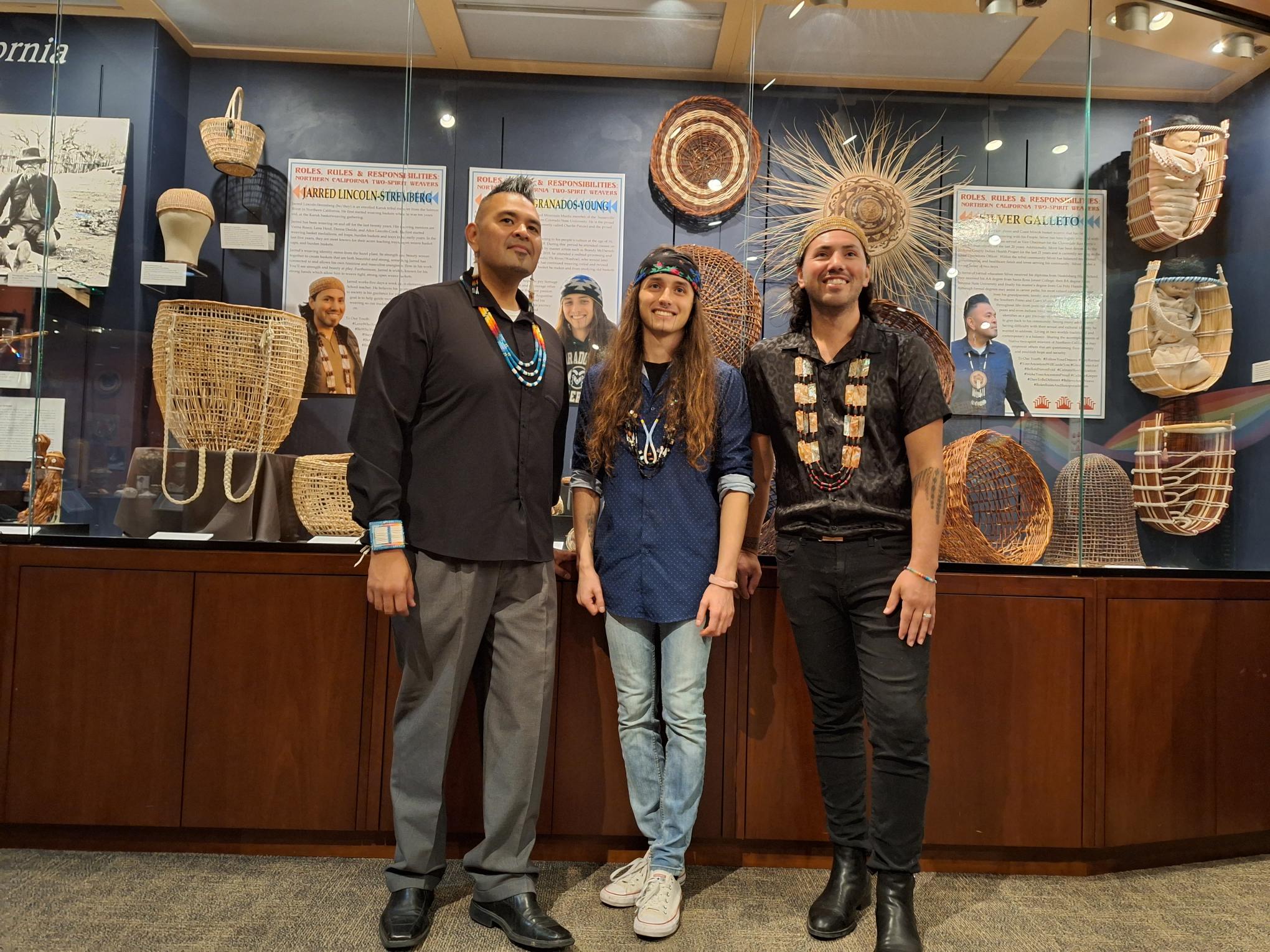Artists in front of their exhibit 