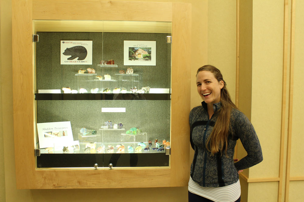 Student employee with her exhibit